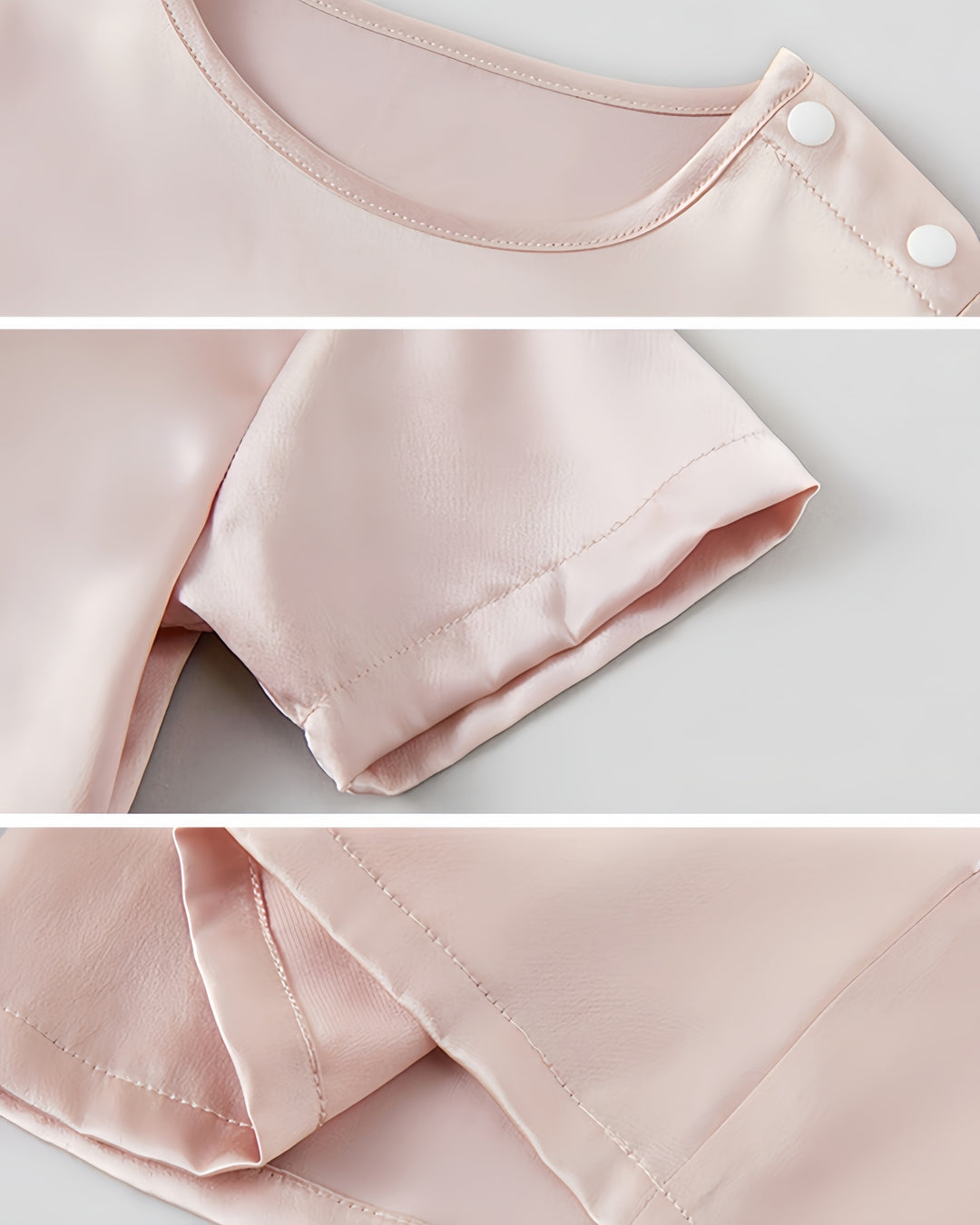 Close-up of a light pink silky blouse, the 19 Momme Baby & Toddler Silk Short Sleeve Top by SusanSilk. The luxurious Mulberry Silk details showcase the shoulder seam with buttons, the short sleeve hem, and the bottom hem stitching, evoking a softness akin to baby's second skin.