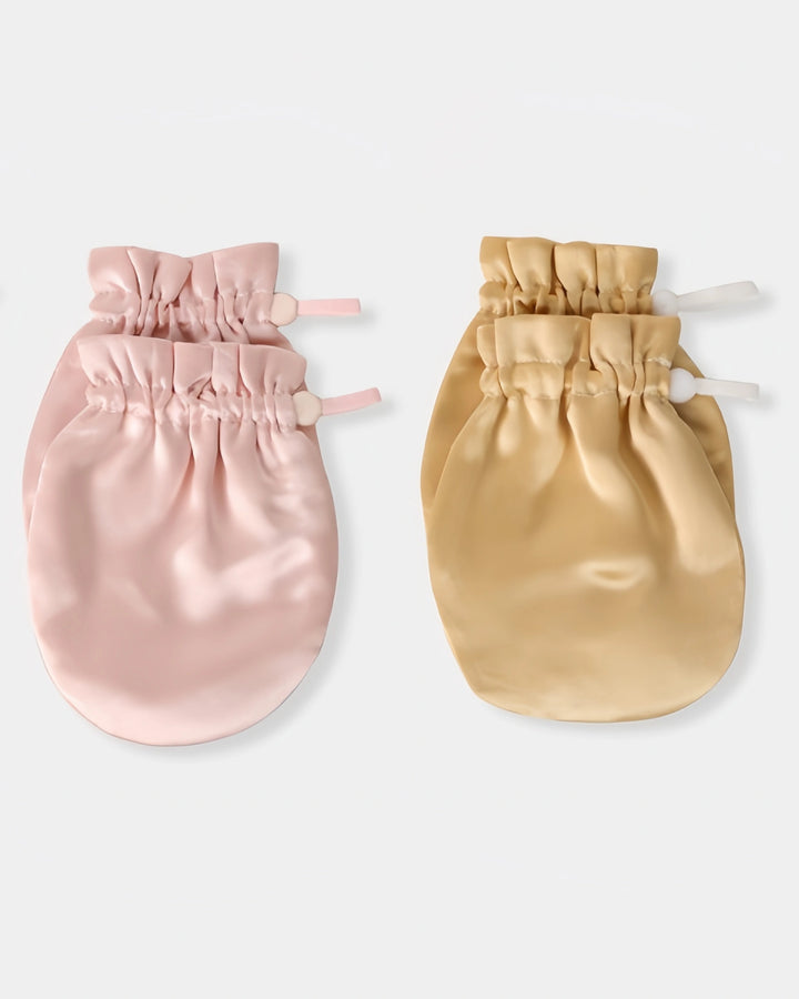 Multiple color options of 19 momme baby silk gloves displayed together, offering stylish and gentle protection against baby face scratching.