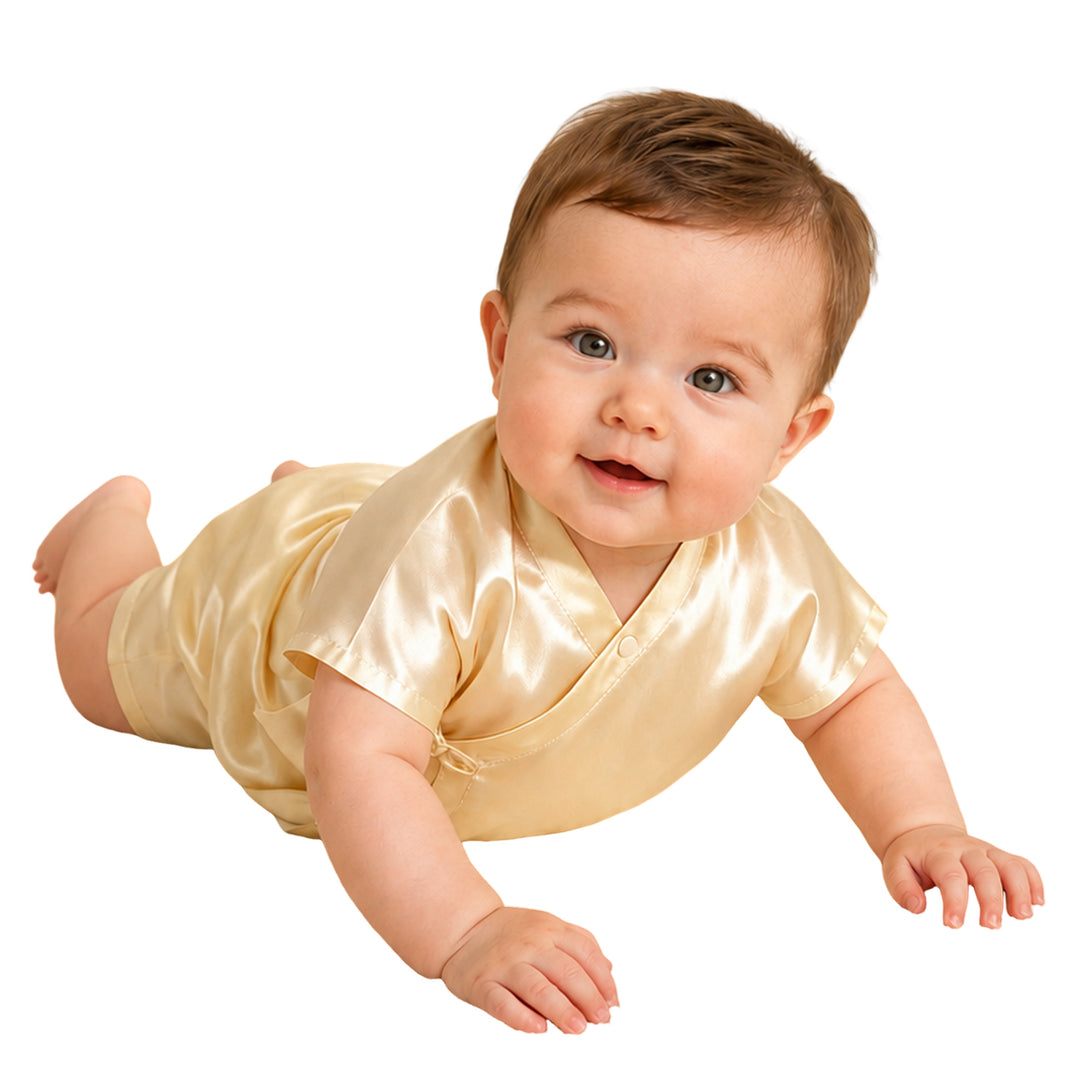Baby wearing a butter cream 19 momme mulberry silk pajama set, soft breathable silk baby sleepwear for sensitive skin.