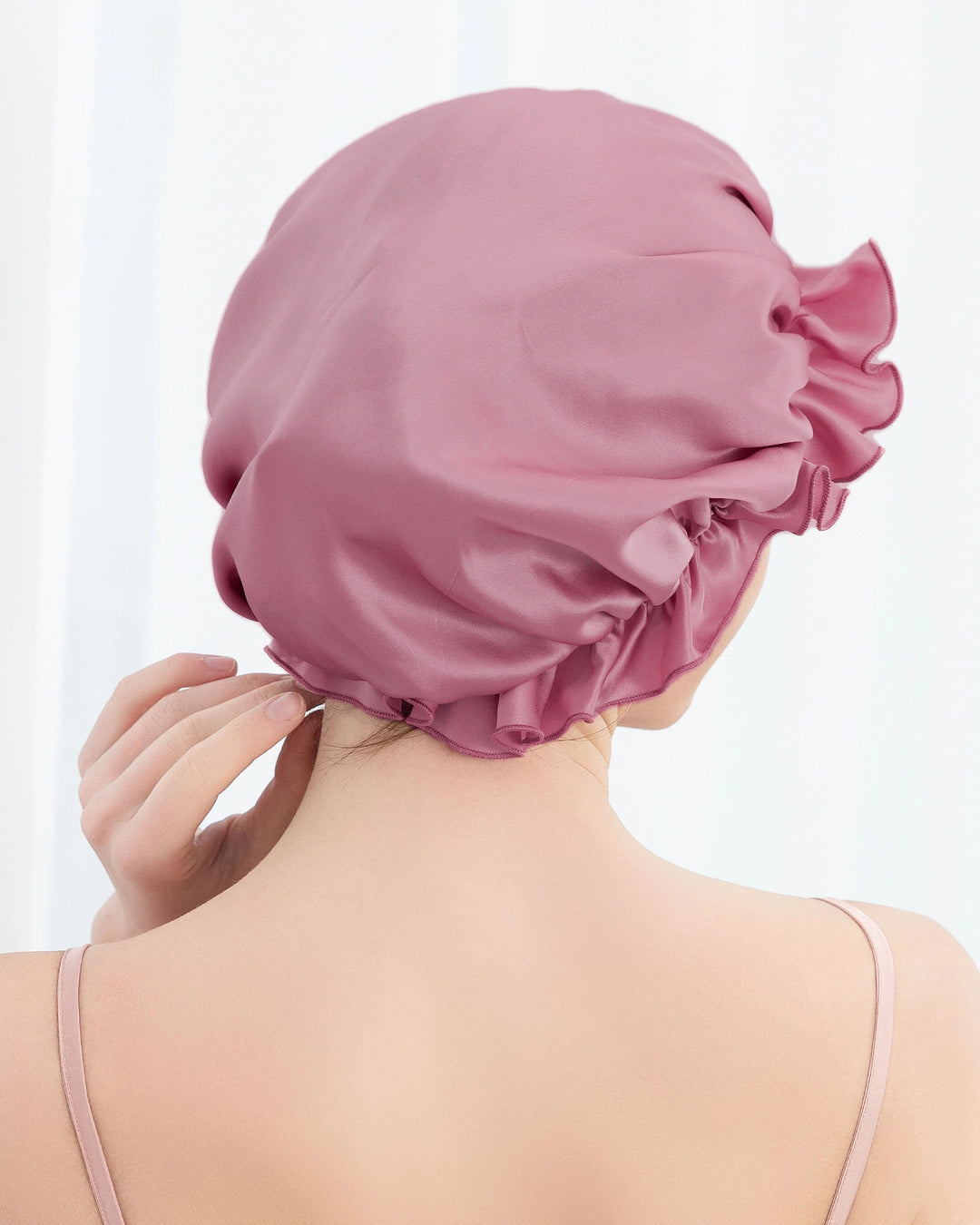 Model wearing mulberry silk ruffled sleep bonnet with elastic edge design, lightweight and gentle silk bonnet for overnight hair care