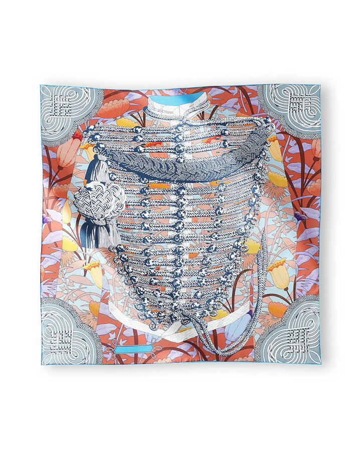 Decorative scarf with intricate patterns and colors on a white background