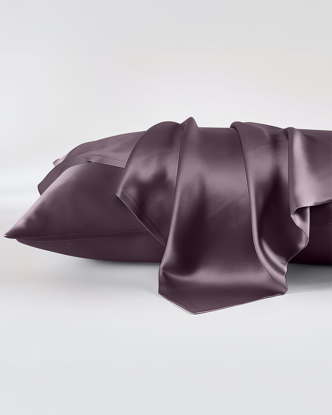 Purple satin sheet set on a white background