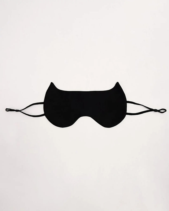 The SusanSilk Cat Shape Silk Eye Mask, featuring a luxurious black silk material with elastic straps, is displayed against a plain white background.