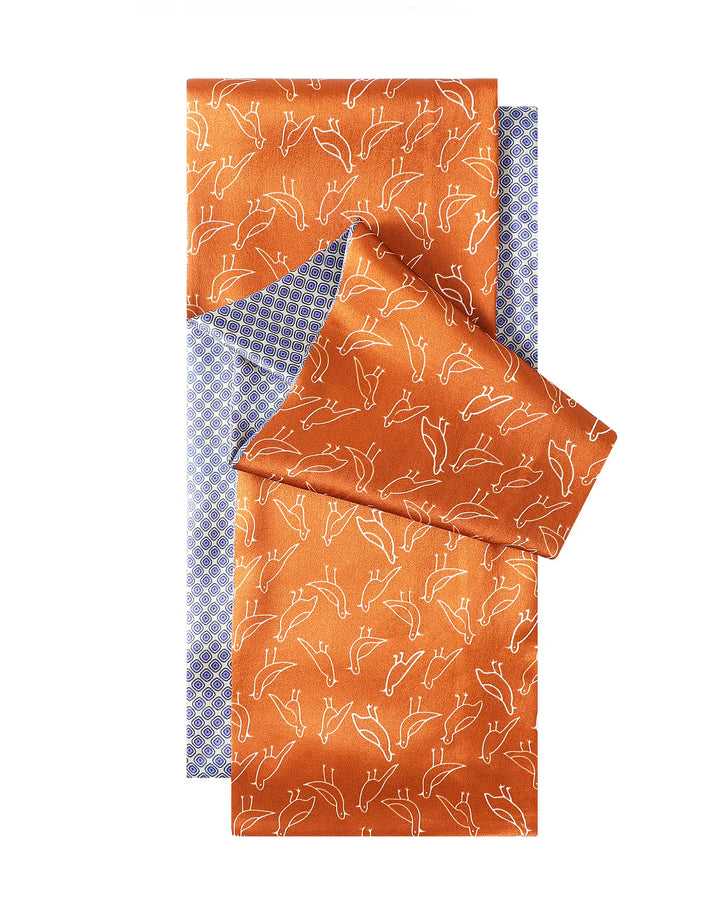Orange fabric with white fox pattern and blue checkered border