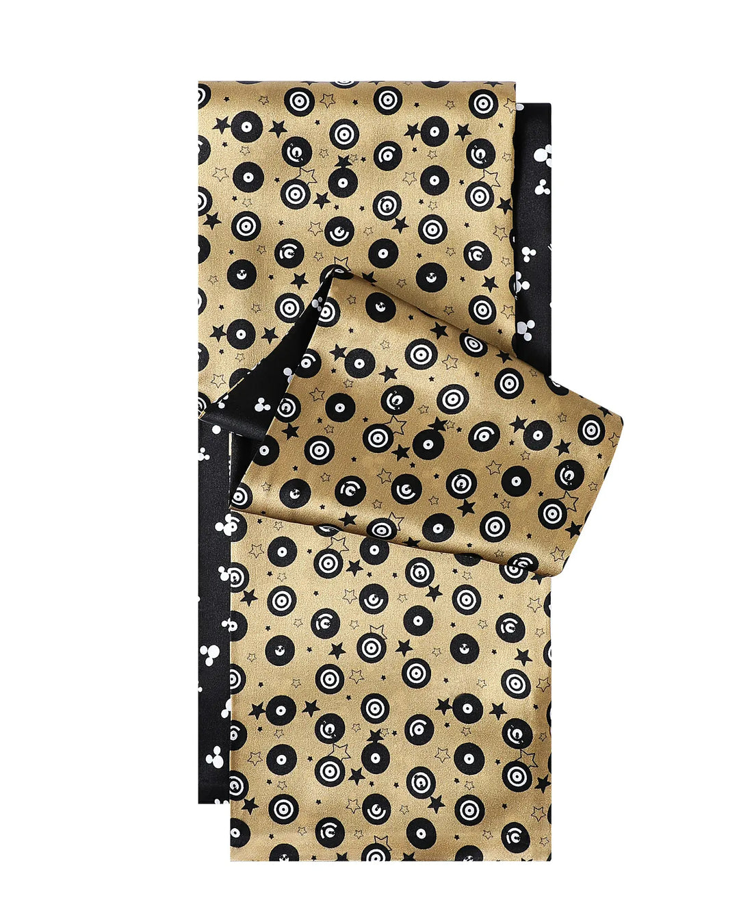 Patterned fabric with black and white designs on a beige background