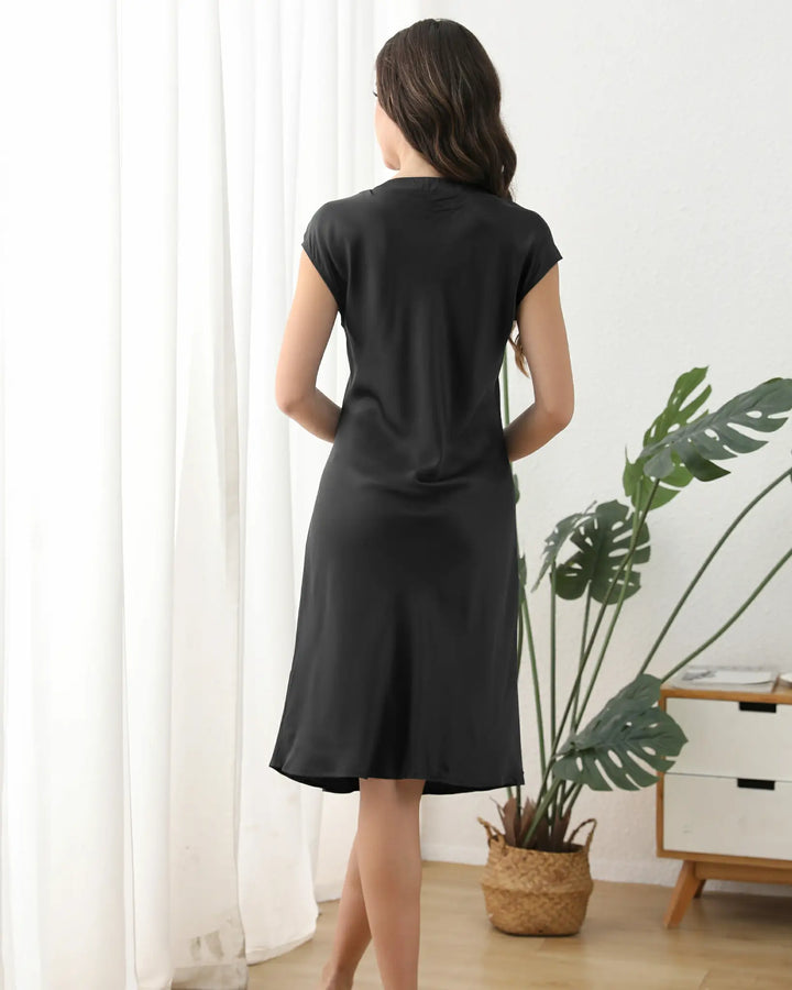 The V-neckline and cap sleeves frame your features delicately, while the loose, relaxed fit ensures unrestricted movement—perfect for lounging, dressing up, or even casual daytime wear.#color_black