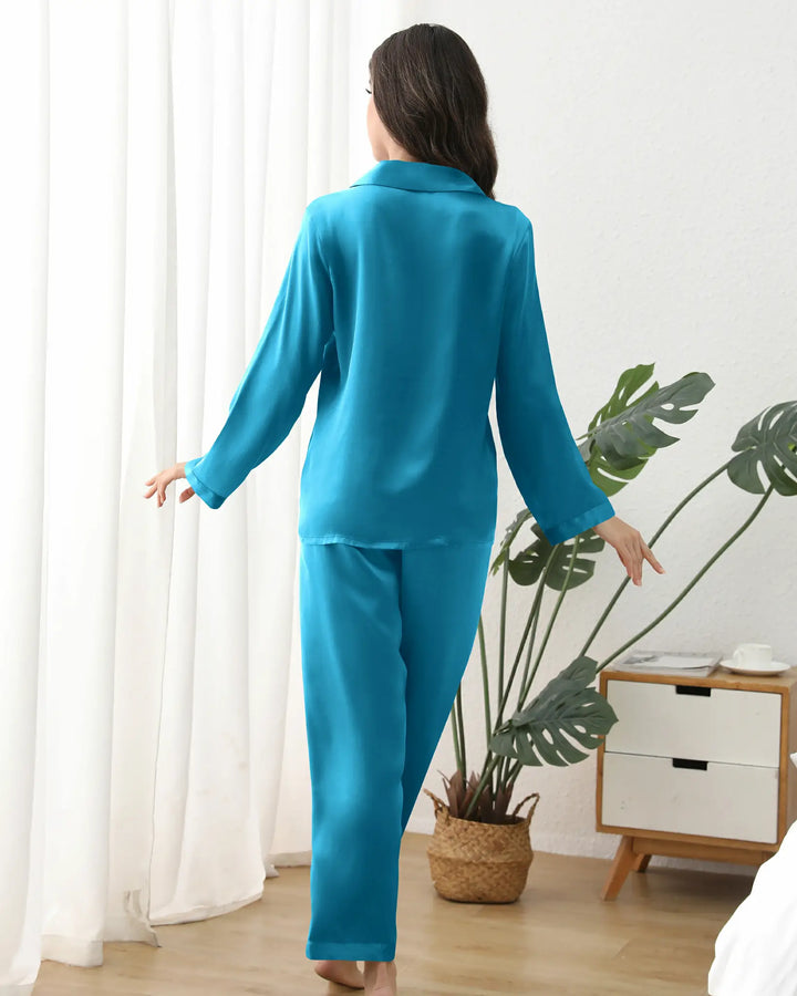 Every detail, from the French seams to the bias-cut hem, reflects artisanal craftsmanship. Hypoallergenic and machine-washable, this versatile set transitions seamlessly from bedtime to casual lounging, making it an ideal gift for anniversaries, birthdays, or a well-deserved self-care treat.#color_peacock-blue