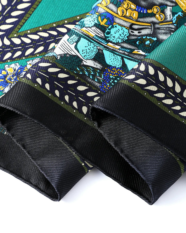Close-up of a patterned fabric with black ribbons on a white background
