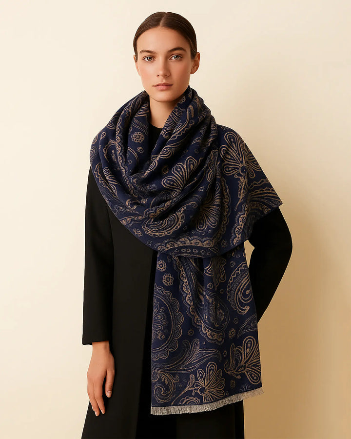 Woman wearing a dark blue patterned scarf on a beige background