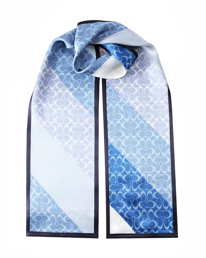Blue and white patterned scarf on a mannequin with a white background