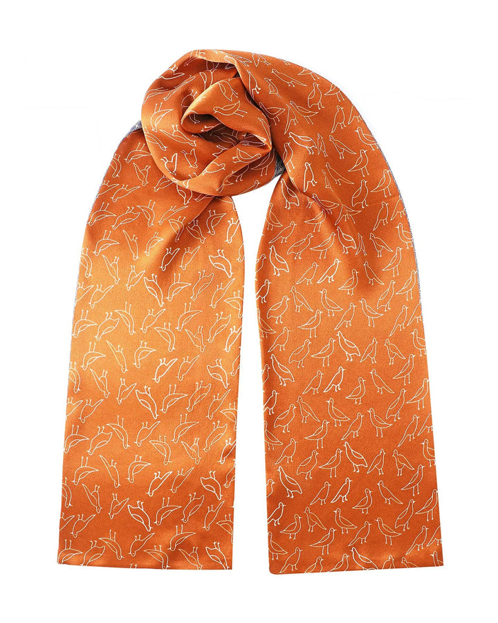 Orange scarf with white fox pattern on a white background