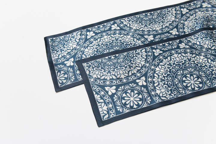 Close-up of the Blue And White Silk Long Fluttering Belt by SusanSilk, showcasing its intricate blue and white floral and geometric pattern against a plain white background.