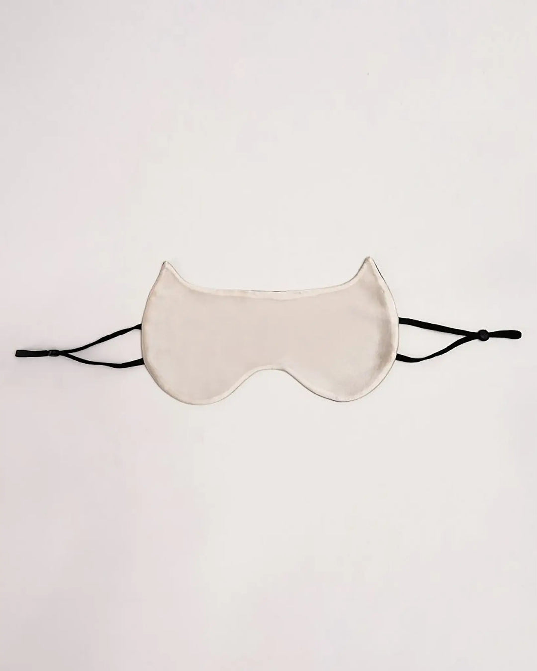 A luxurious SusanSilk Cat Shape Silk Eye Mask, featuring black adjustable straps, set against a plain background.