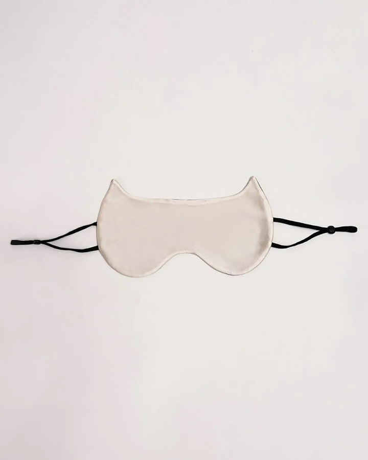 A luxurious SusanSilk Cat Shape Silk Eye Mask, featuring black adjustable straps, set against a plain background.