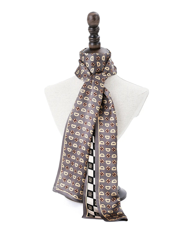 Patterned scarf on a mannequin with a white background