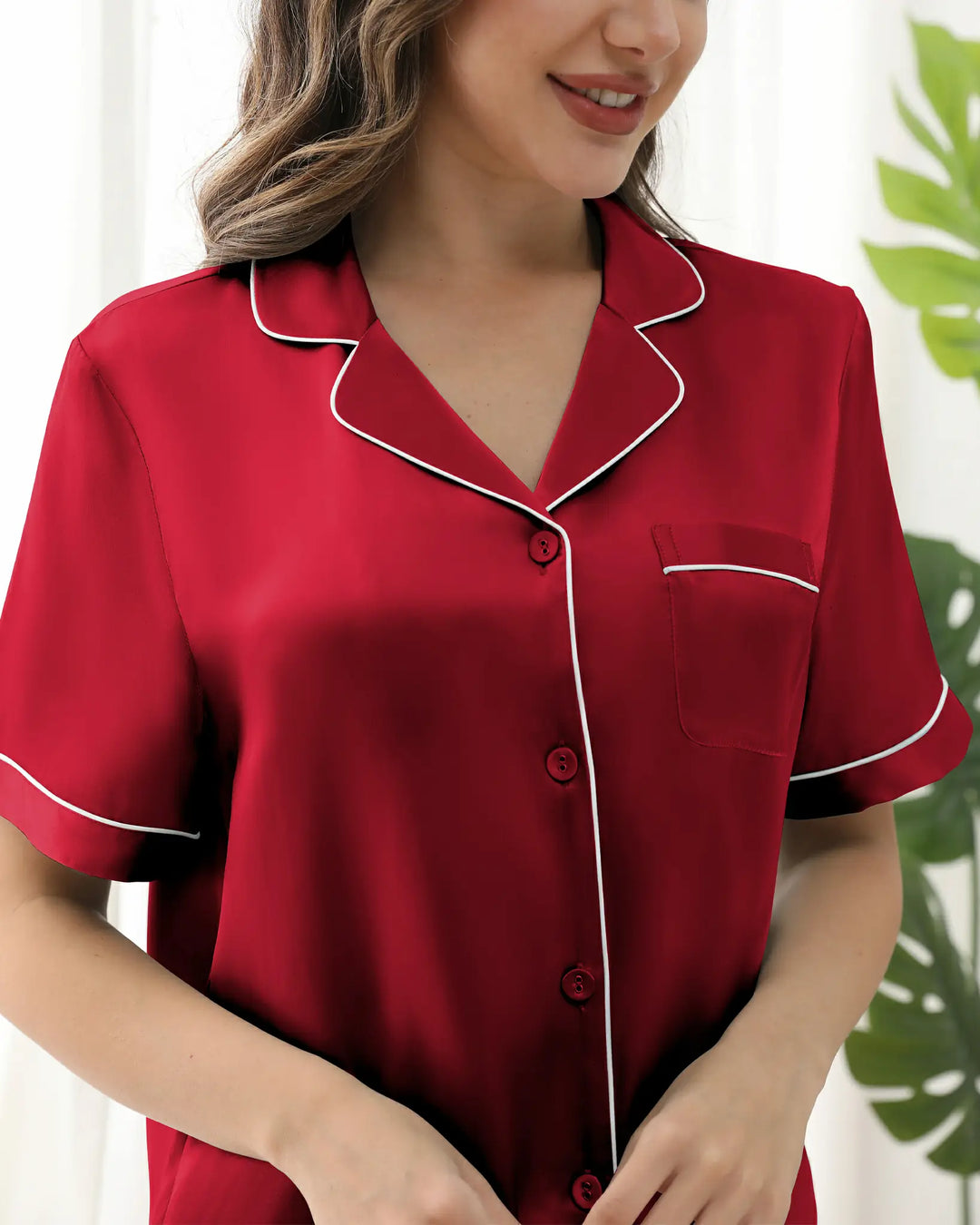 and a buttery-soft texture that glides over the skin. The classic notched collar and subtle piping trim deliver a polished aesthetic, while delicate same color buttons ensure a clean silhouette.#color_garnet