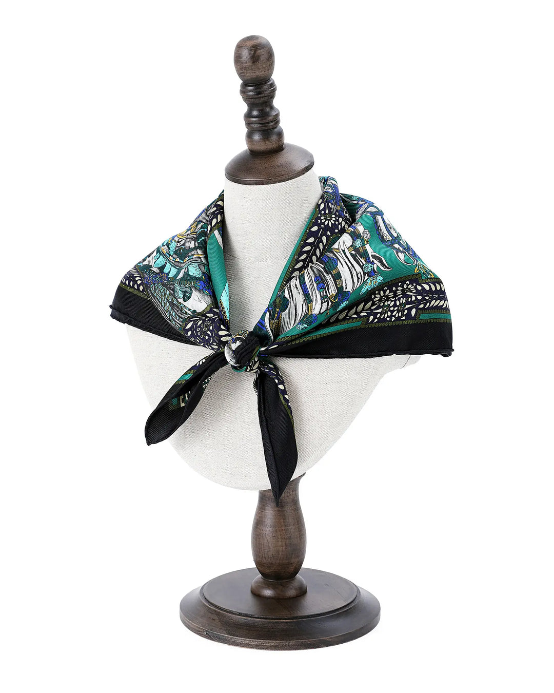 Mannequin head with a patterned scarf on a white background