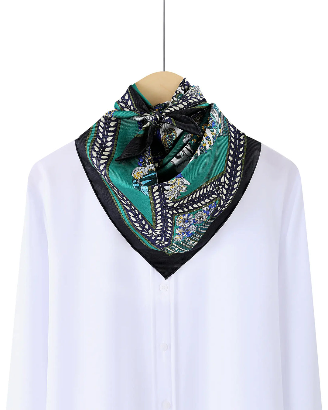 Green patterned scarf on a mannequin with a white background