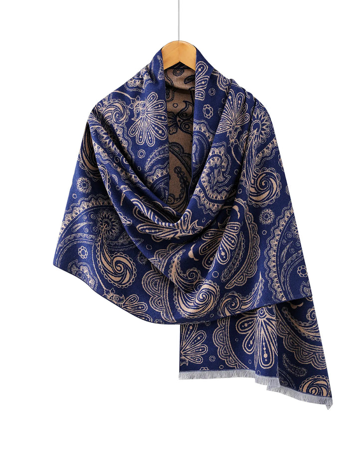 Blue paisley patterned scarf on a hanger against a white background