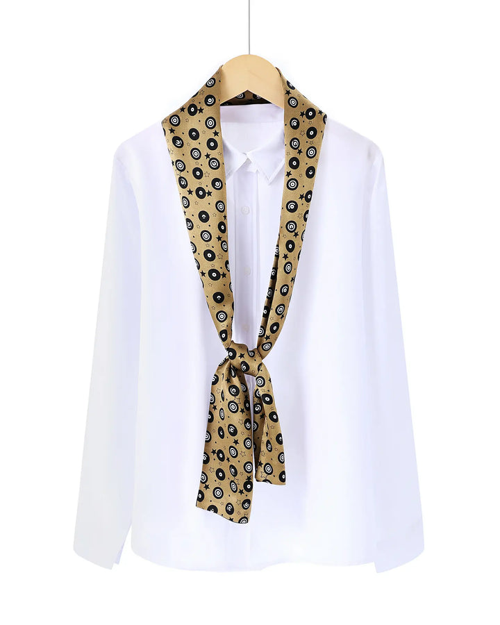 White shirt with a patterned scarf tied around the neck on a white background