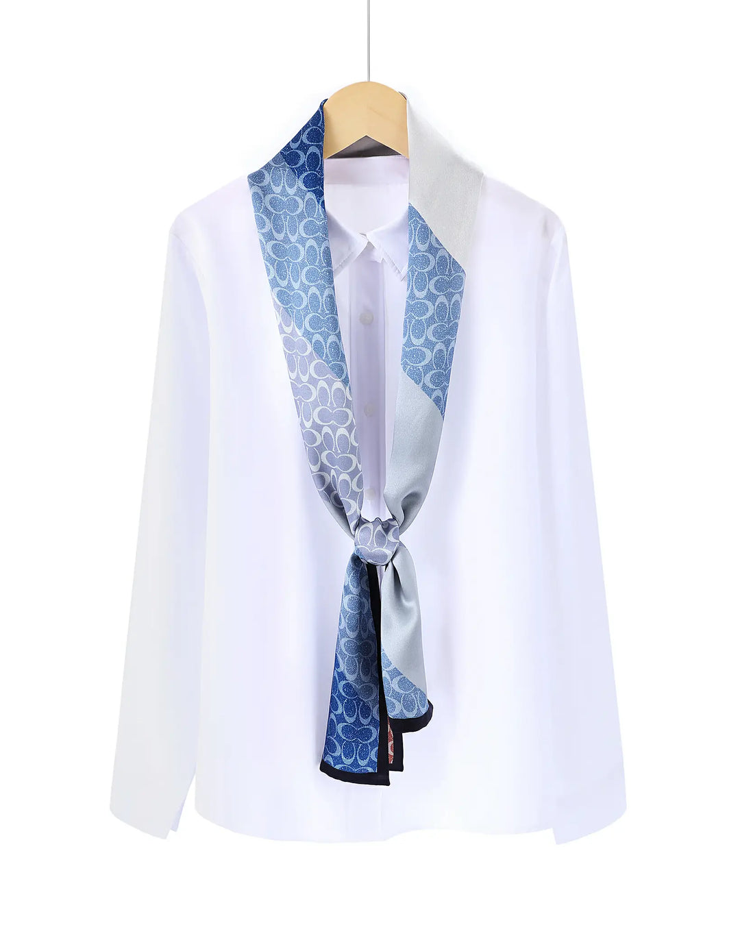 White shirt with a blue patterned scarf tied around the neck on a white background