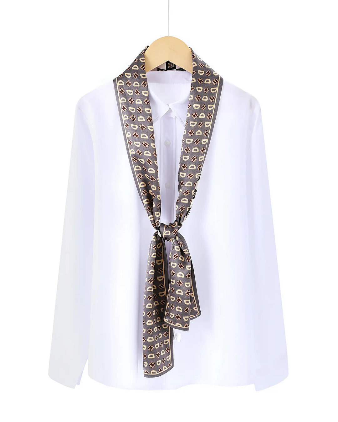White shirt with a patterned scarf draped over the shoulders on a white background