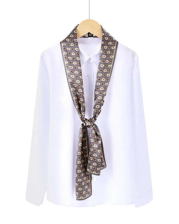 White shirt with a patterned scarf draped over the shoulders on a white background