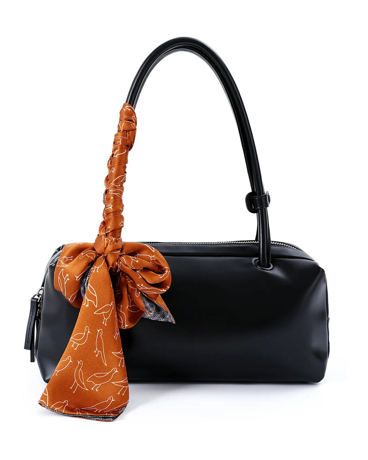 Black handbag with a brown handle and matching scarf on a white background