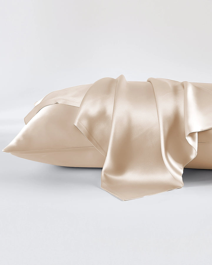 Beige satin pillowcase on a light gray background