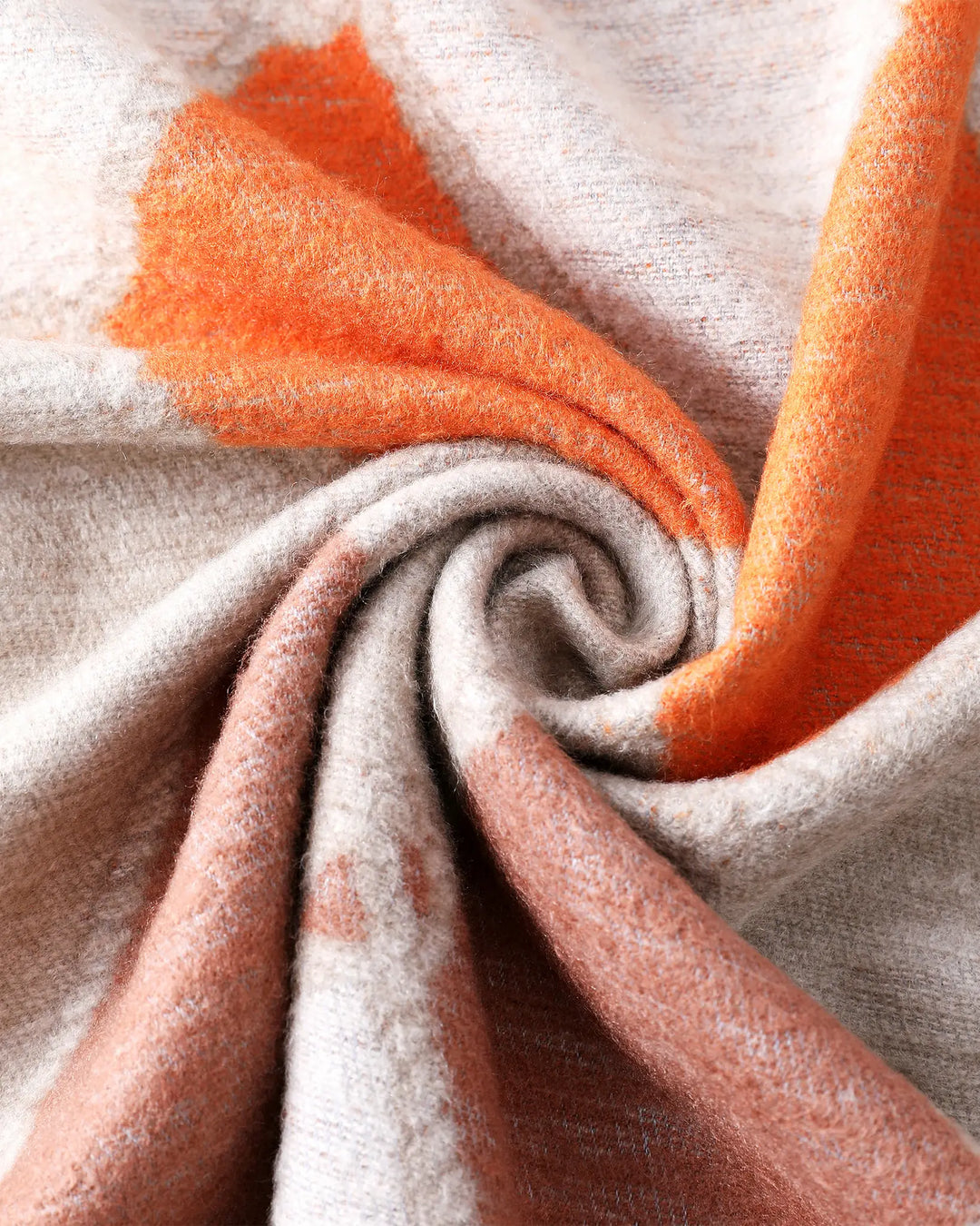 Close-up of textured fabric with orange and beige colors