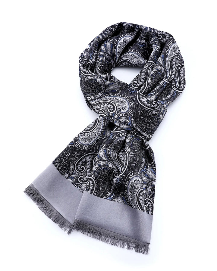 A black and gray paisley scarf with a solid gray border and fringed ends, displayed on a clean white background.#color_silver