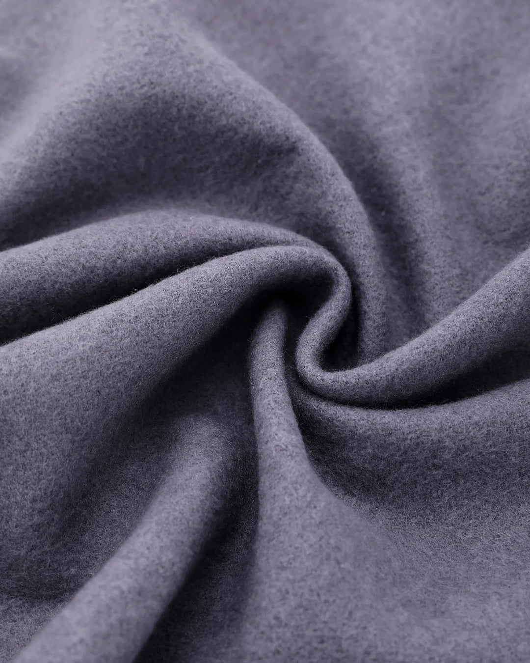 A close-up of draped gray fabric with a soft, slightly fuzzy texture, arranged in a spiral fold pattern.#color_silver