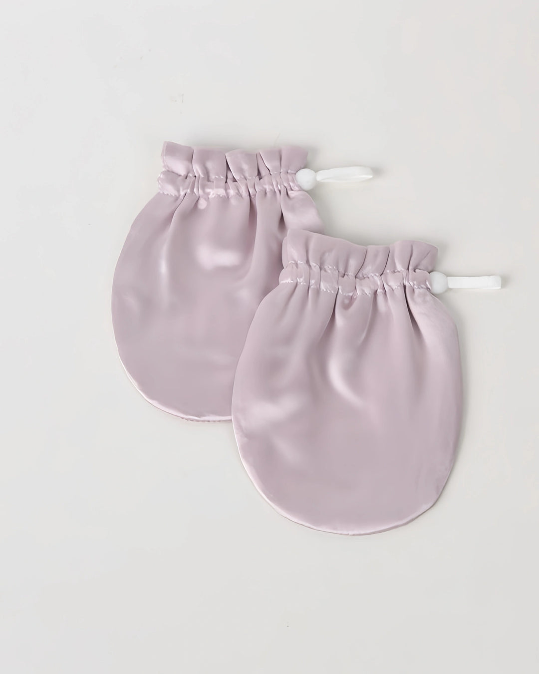 19 momme baby silk gloves that help reduce face grabbing and promote calm sleep with breathable natural silk fabric.