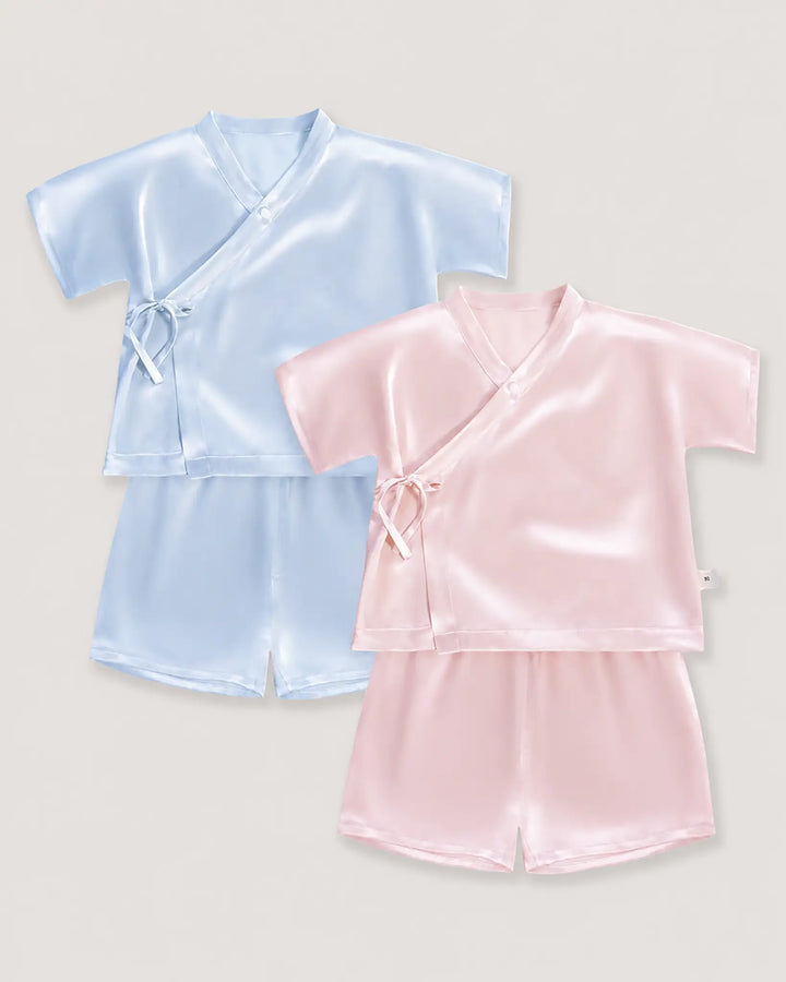 Pink and blue 19 momme mulberry silk baby pajama sets featuring kimono wrap tops and breathable silk shorts