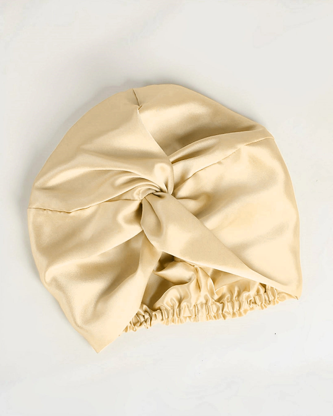 Champagne gold double layer mulberry silk sleep bonnet laid flat, luxury fully lined silk bonnet with soft sheen finish