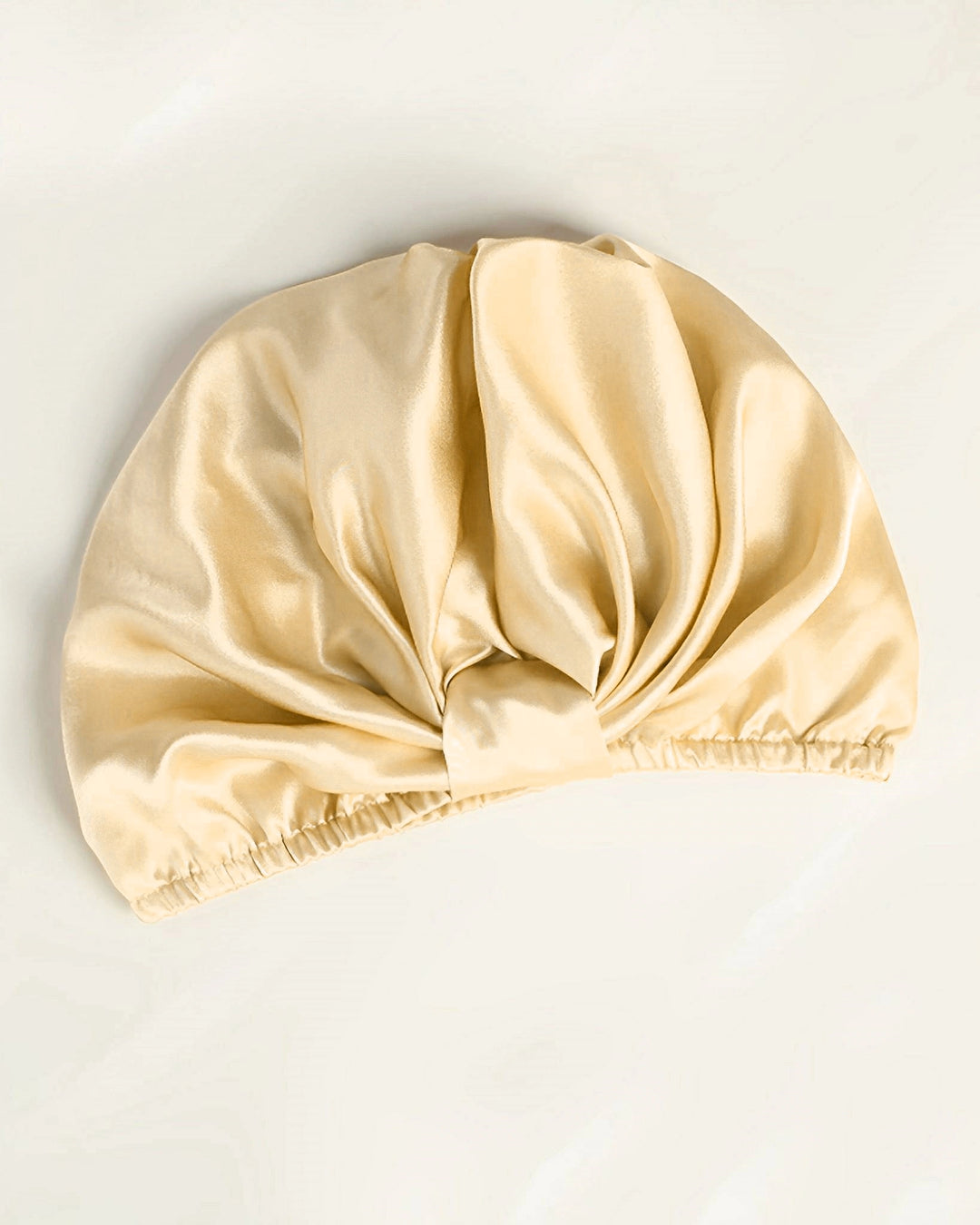 Champagne gold mulberry silk sleep bonnet laid flat, luxury double layer silk bonnet with soft sheen finish
