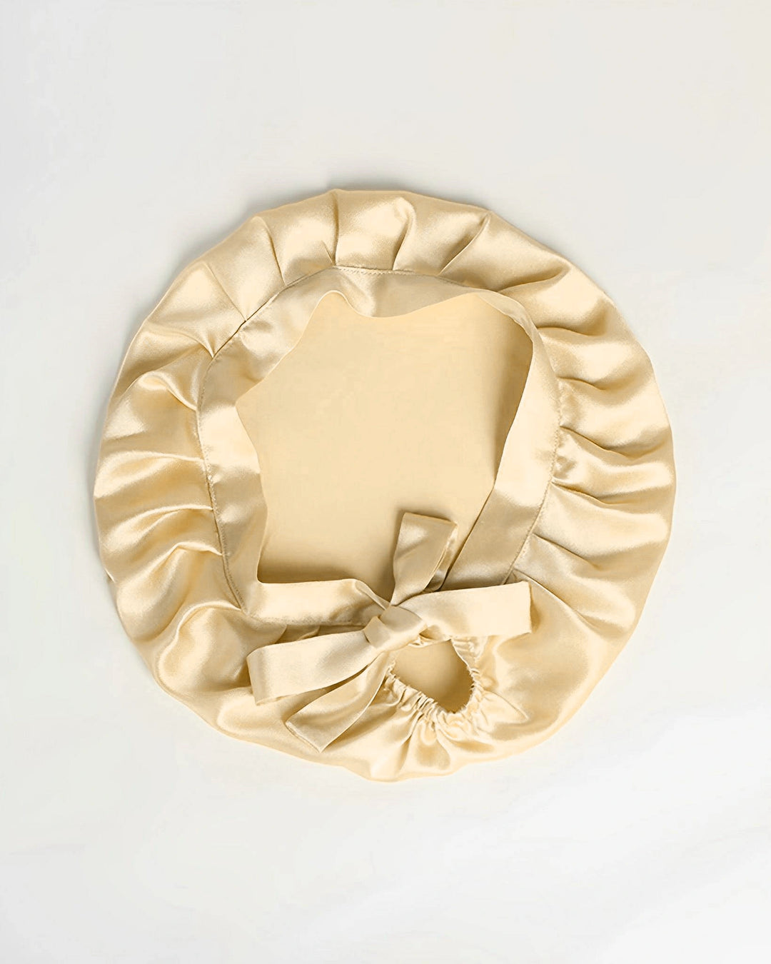 Champagne gold mulberry silk tie back sleep bonnet laid flat, luxury double layer silk bonnet with soft sheen finish