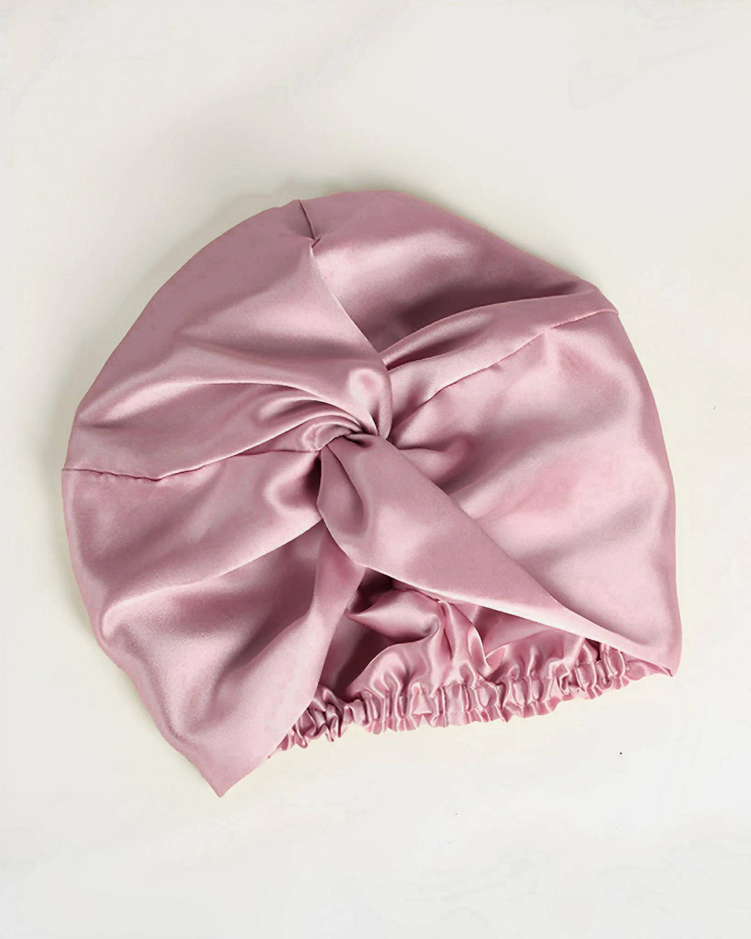 Dusty rose double layer mulberry silk sleep bonnet laid flat, elegant fully lined silk bonnet for gentle hair care