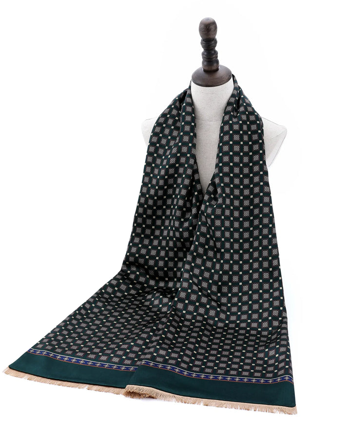 Green luxury silk scarf displayed as an elegant autumn and winter fashion accessory.#color_forest-green