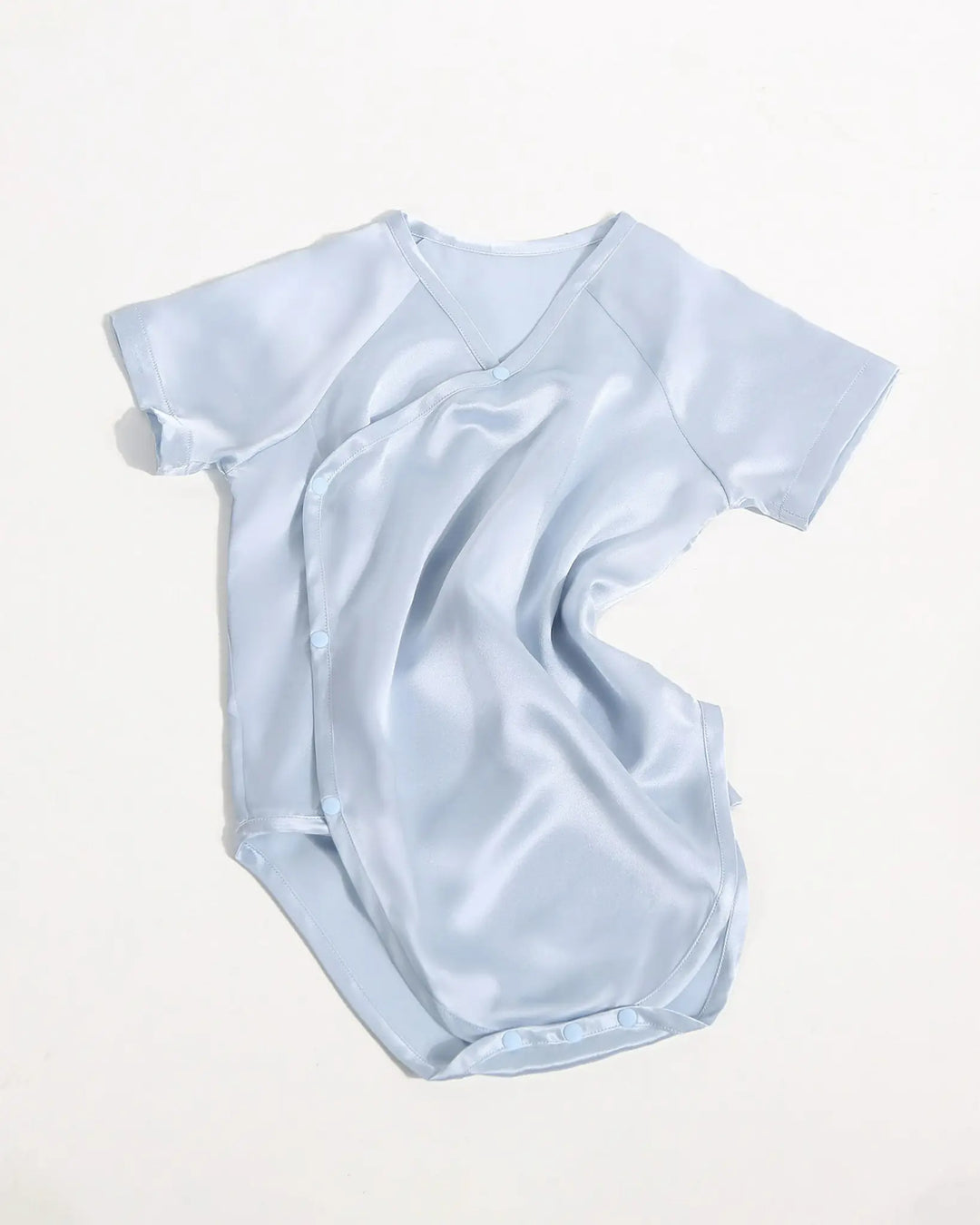 Ice blue mulberry silk baby kimono onesie with side snap buttons and lightweight breathable silk fabric