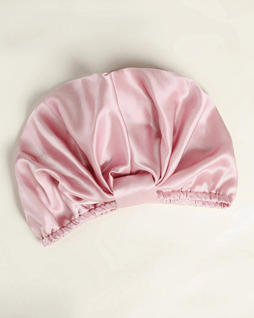 Light pink mulberry silk sleep bonnet laid flat, breathable smooth silk bonnet suitable for all hair types