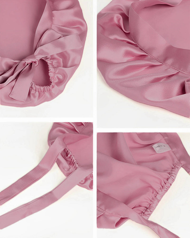 Blush pink mulberry silk tie back sleep bonnet laid flat, elegant silk bonnet with ribbon tie back design