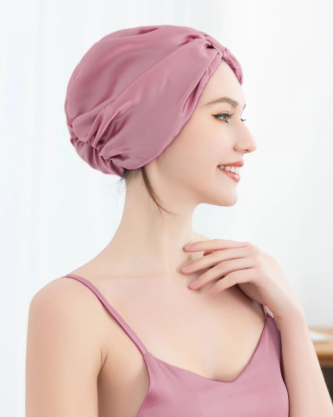 Model wearing luxury mulberry silk sleep bonnet, stylish and lightweight design suitable for all hair types