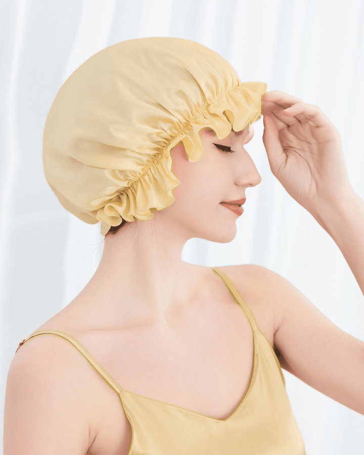 Model wearing mulberry silk ruffled sleep bonnet with elastic edge design, lightweight and gentle silk bonnet for overnight hair care