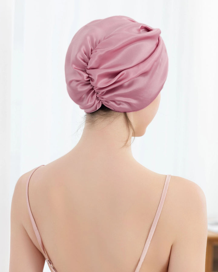 Model wearing mulberry silk sleep bonnet with pleated back design, suitable for thick and long hair, smooth and breathable silk bonnet