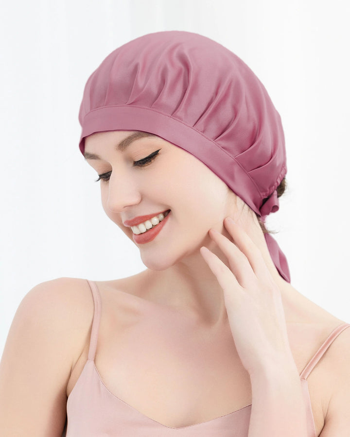 Model wearing mulberry silk sleep bonnet with tie back ribbon design, soft breathable silk bonnet for overnight hair care