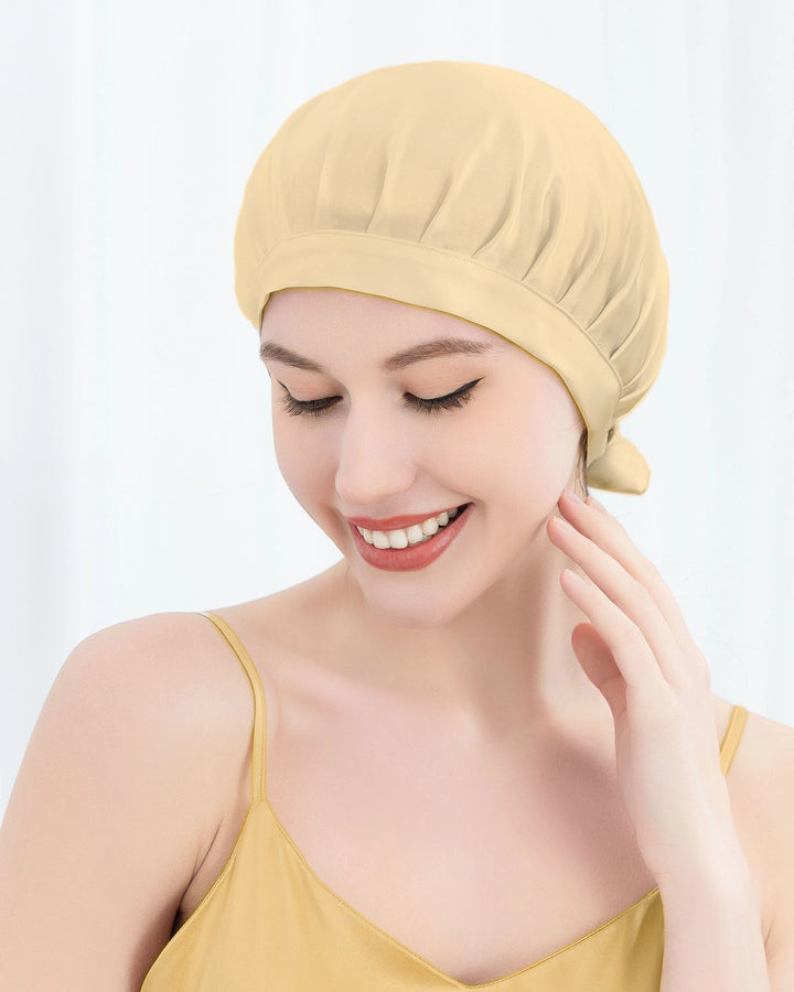 Back view of model wearing mulberry silk sleep bonnet with ribbon tie back design, suitable for thick and long hair