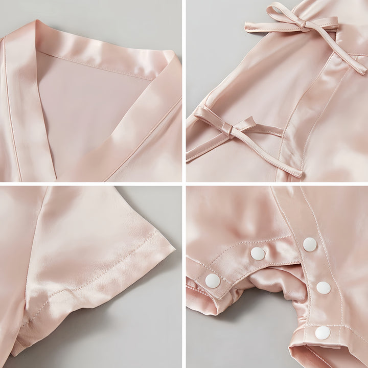Collage of four images displaying different angles of a light pink 19 Momme Silk Baby Button Lace-Up Onesie by SusanSilk with various close-ups: the collar, tie closure, sleeve seam, and snap buttons.
