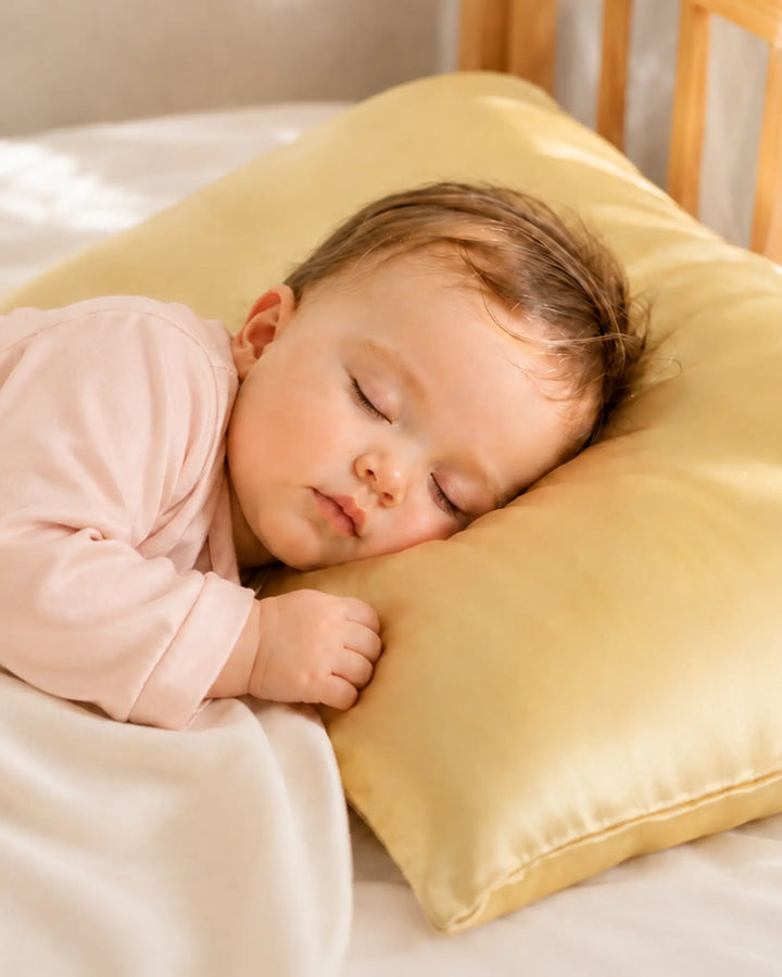 Toddler sleeping on soft mulberry silk pillowcase designed for sensitive skin and comfortable sleep