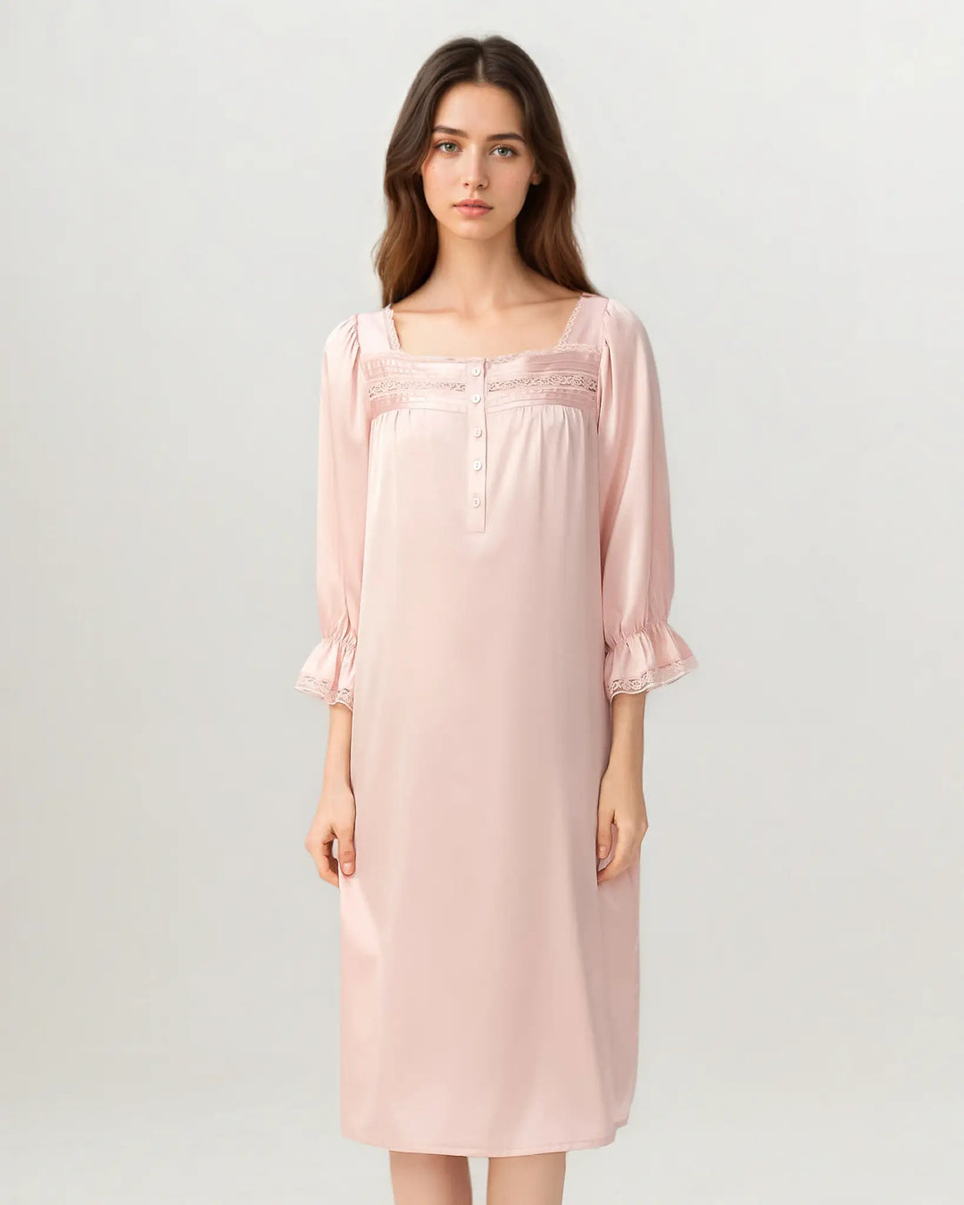 Side view of women’s soft pink silk nightdress with relaxed midi-length silhouette.#color_rose-pink
